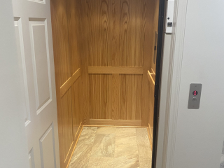 Symmetry Elevating Solutions In Line Gear Drive Residential Elevator with Custom Flooring and an Enterprise Gate