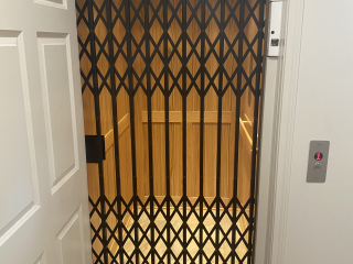 Symmetry Elevating Solutions In Line Gear Drive Residential Elevator with Custom Flooring and an Enterprise Gate