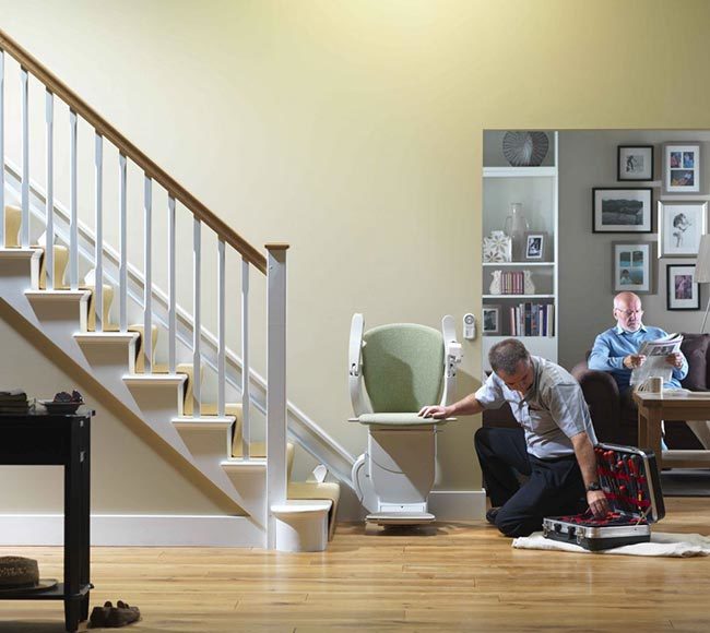 Technician Working on a Chair Lift in a Home in Rochester, Erie, Ithaca, NY, and Buffalo