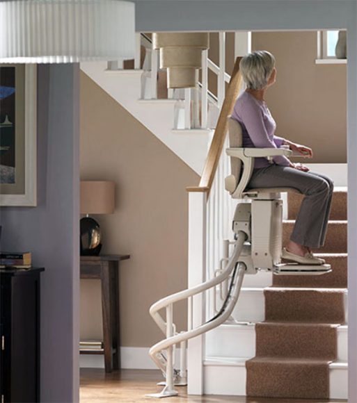 Elderly Woman on a Curved Stair Lift on Stairs in Buffalo, Rochester, Ithaca, NY