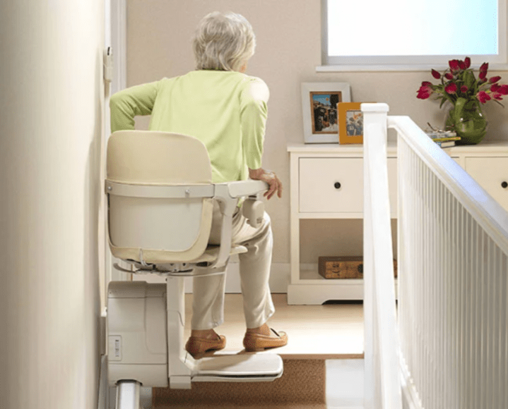 Woman on Stairs in a Chair Lift in Buffalo, Rochester, Ithaca, NY, and Erie