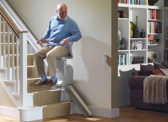 Man Sitting on Stair Lift | Home Elevators, LU/LA Elevators, Stair Lifts, Wheelchair Lifts for Erie, PA