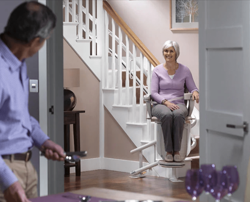 Elderly Woman Sitting on a Stairway Lifts and Stair Lifts in Rochester, Buffalo, Ithaca, NY, and Erie