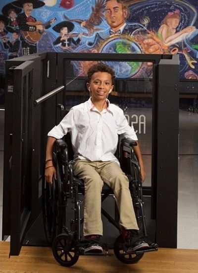 Young Boy in Wheelchair on a Wheelchair Lift in Pittsburgh, Rochester, Ithaca, NY, Morgantown, NY, Buffalo, and Erie